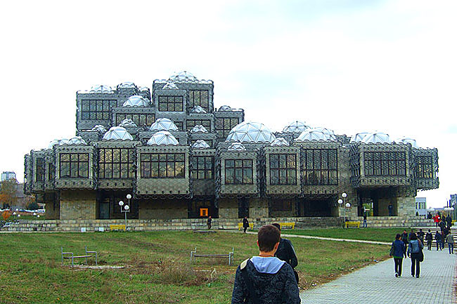 <p><strong>9. NATIONAL LIBRARY, PRISTINA, KOSOVO.</strong> It's hard to know whether the honeycomb-pattern mesh that coats the outside of this library enhances or worsens this bizarre structure. It's been said that when the building first opened, some thought the giant net-like feature was actually scaffolding / Flickr user Nevermind This</p>