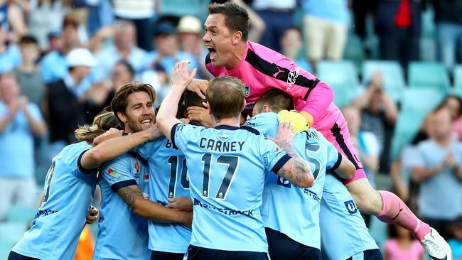 Alex Brosque is swamped by team mates. Picture : Gregg Porteous