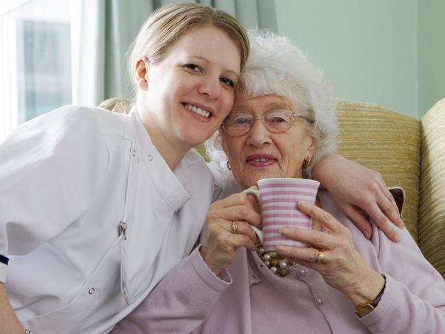 A carer and her elderly patient share a hug together. Picture: Thinkstock