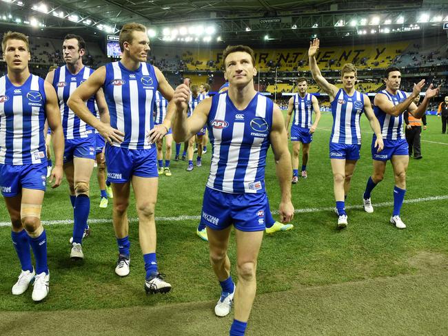 Brent Harvey, Drew Petrie, Nick Dal Santo and Michael Firrito leave the field. (AAP Image/Tracey Nearmy)