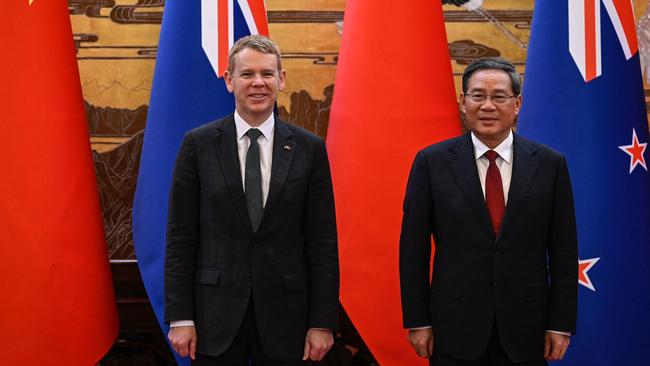 Chinese Premier Li Qiang (R) with Chris Hipkins at the Great Hall of the People in Beijing in June. Picture: AFP.