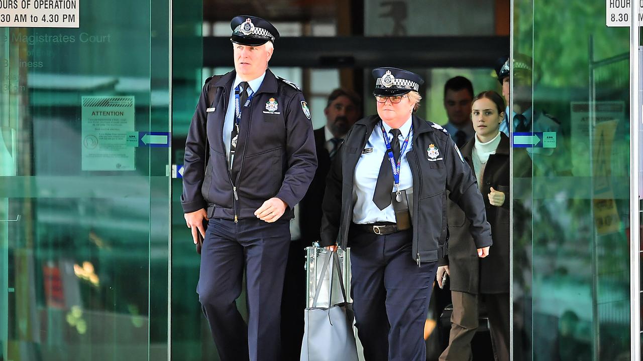 Sergeant Elise Feltham and another Police officer walk out of the Brisbane Magistrates Court. Picture: John Gass/NCA NewsWire