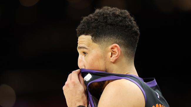 PHOENIX, ARIZONA - MAY 15: Devin Booker #1 of the Phoenix Suns reacts during the first half in Game Seven of the 2022 NBA Playoffs Western Conference Semifinals against the Dallas Mavericks at Footprint Center on May 15, 2022 in Phoenix, Arizona. NOTE TO USER: User expressly acknowledges and agrees that, by downloading and/or using this photograph, User is consenting to the terms and conditions of the Getty Images License Agreement. (Photo by Christian Petersen/Getty Images)