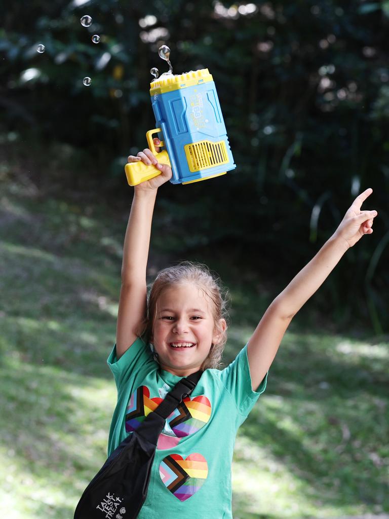 Mackenzie Powman has fun making bubbles at the Cairns Pride Festival's Pride Fair day, held at the Tanks Arts Centre, Edge Hill. Picture: Brendan Radke