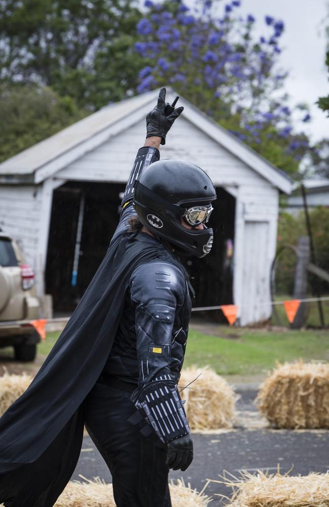 Greenmount Billy Cart Challenge committee member and racer Doug Gale as Batman gees up the crowd, Saturday, November 25, 2023. Picture: Kevin Farmer