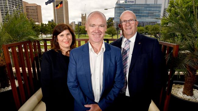 New Tour Down Under race director Stuart O'Grady (centre) with Events SA executive director Hitaf Rasheed (left) and Tourism Minister David Ridgway. Picture: AAP Image/Sam Wundke