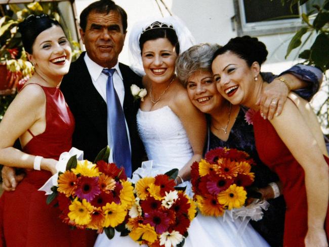 Maria Kotronakis (centre) on the day of her wedding with parents Peter and Vicky and sisters, twin Dimmy (left) and Elizabeth Kotronakis (right). A week later, Dimmy and Lizzy died in the 2002 Bali bombings.