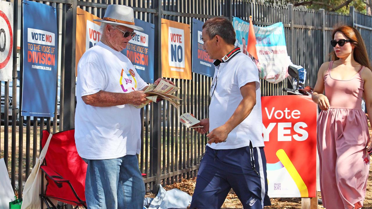 Volunteers greet people arriving at the Inala voting centre. Picture: Tertius Pickard