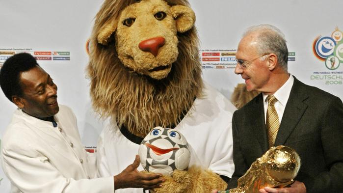 Former soccer player Pele (l) with Franz Beckenbauer, head of 2006 World Cup organising committee, unveiling lion puppet "Goleo VI" and "sidekick" talking soccer ball "Pillie" - official mascots of 2006 soccer World Cup in Germany 13 Nov 2004. six