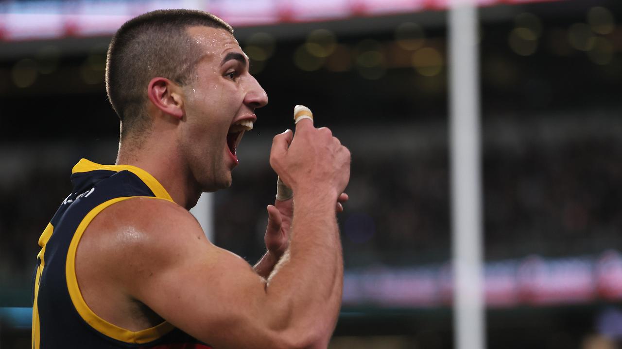 ADELAIDE, AUSTRALIA - AUG 17: Josh Rachele of the Crows gestures to the crowd after scoring a goal during the 2024 AFL Round 23 match between the port Adelaide Power and the Adelaide Crows at Adelaide Oval on August 17, 2024 in Adelaide, Australia. (Photo by James Elsby/AFL Photos via Getty Images)