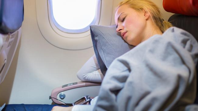 how-to-sleep-on-a-plane-to-avoid-a-bad-back-stiff-neck-or-swollen-legs