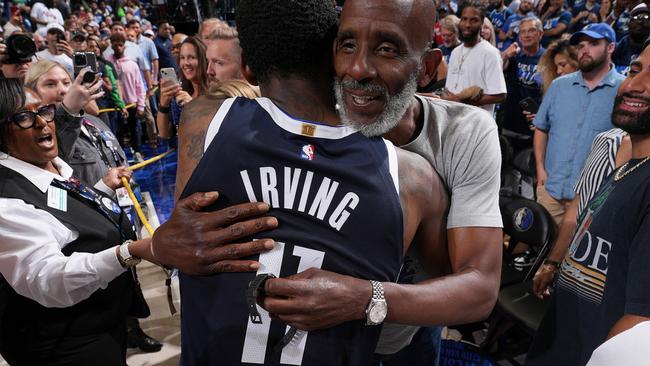 DALLAS, TX - MAY 26: Kyrie Irving #11 of the Dallas Mavericks greets his father, Drederick Irving after the game against the Minnesota Timberwolves during Game 3 of the Western Conference Finals of the 2024 NBA Playoffs on May 26, 2024 at the American Airlines Center in Dallas, Texas. NOTE TO USER: User expressly acknowledges and agrees that, by downloading and or using this photograph, User is consenting to the terms and conditions of the Getty Images License Agreement. Mandatory Copyright Notice: Copyright 2024 NBAE (Photo by Jesse D. Garrabrant/NBAE via Getty Images)