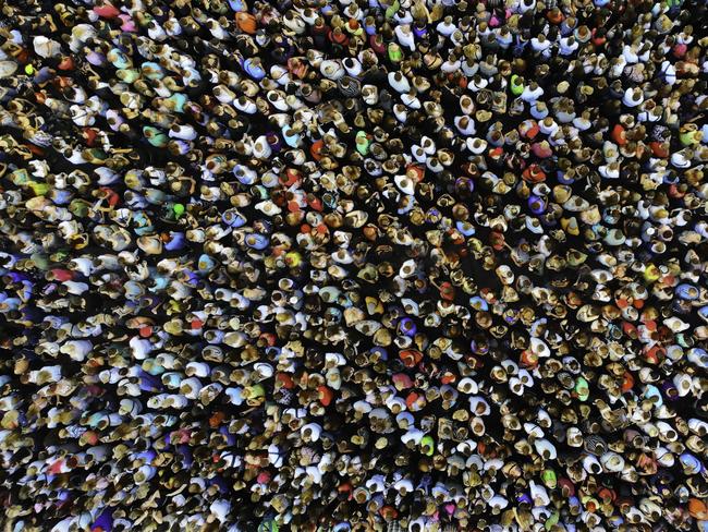 Big crowd of people, population generic. People gathered together in one place. Top view from drone. Picture: iStock