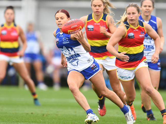 HOBART, AUSTRALIA - MARCH 07: Jenna Bruton of the Kangaroos runs the ball during the round five AFLW match between the North Melbourne Kangaroos and the Adelaide Crows at North Hobart Oval on March 07, 2020 in Hobart, Australia. (Photo by Steve Bell/Getty Images)