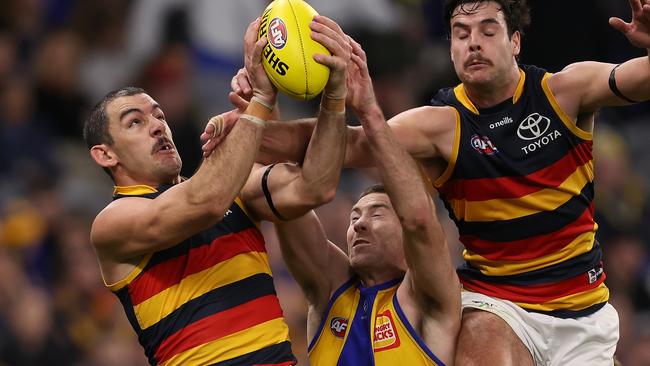 Crow Taylor Walker takes a strong mark opposed to West Coast’s Jeremy McGovern in his side’s 45-point win in Perth last Saturday. Picture: Paul Kane/Getty Images.