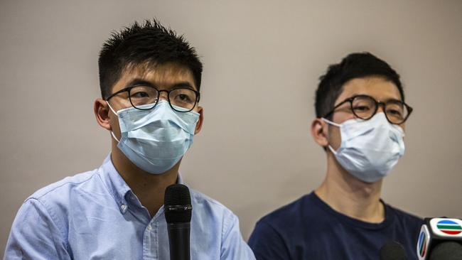 Joshua Wong, left, with Nathan Law, said he believed the removal of the books was sparked by the security law. Picture: AFP