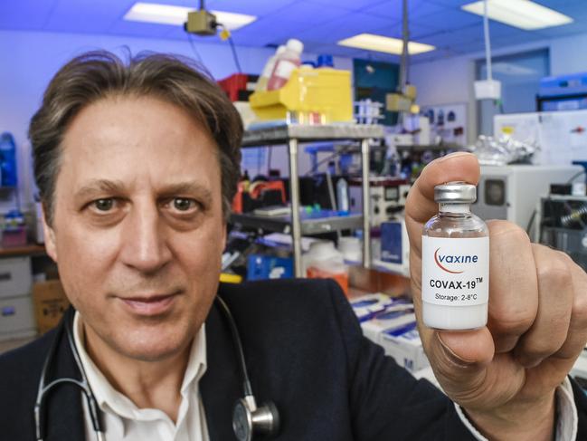 Flinders University Professor Nikolai Petrovsky with his coronavirus vaccine candidate. Picture: Roy Van Der Vegt