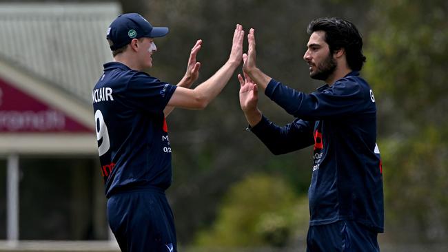 Elsternwick’s Callum Sinclair and Zachariah Grundmann-Perera celebrate a wicket against Strathmore in November. Picture: Andy Brownbill