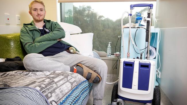 Angus Dennis-Hewett, 17, is supported by two artificial hearts on the Koala ward at the Royal Childrens’ Hospital in Melbourne. Picture: Mark Stewart