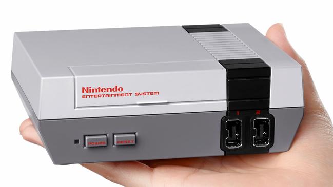 This undated picture released by Nintendo on November 10, 2016 shows the North American version of the eighties era games console, "Nintendo Entertainment System: NES Classic Edition".  Nintendo on November 10 launched a palm-sized version of its eighties era games console, setting up an old versus new showdown with rival Sony as it released a new PlayStation 4. / AFP PHOTO / Nintendo / STR / RESTRICTED TO EDITORIAL USE - MANDATORY CREDIT "AFP PHOTO / (c)2016 Nintendo" - NO MARKETING - NO ADVERTISING CAMPAIGNS - DISTRIBUTED AS A SERVICE TO CLIENTS