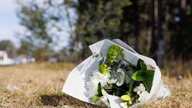 Flowers left at the crash site on Monday. Picture: David Swift