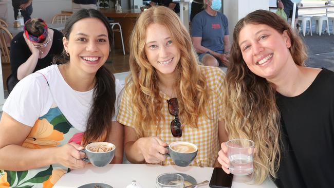 Alicia Hinkley, Kate Fletcher and Ally Van Summeren enjoy breakfast in Albert Park after lockdown. Picture: NCA NewsWire / David Crosling