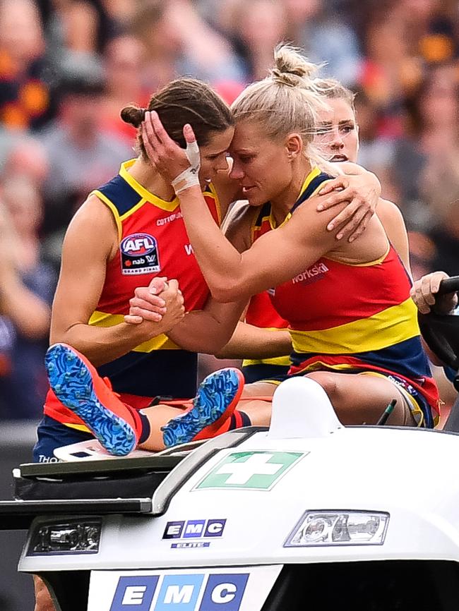 Phillips is consoled by a teammate after her injuring her knee. Picture: Getty Images