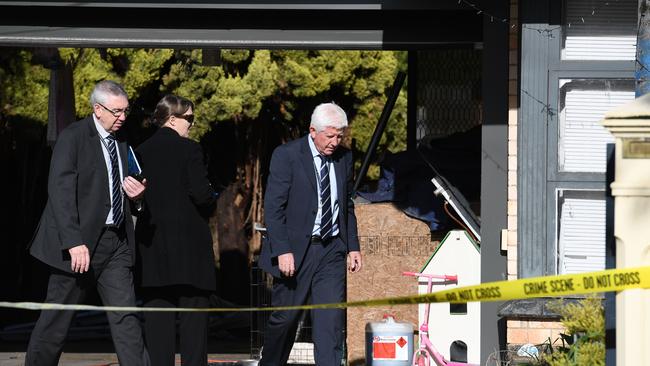 Major Crime and forensic investigators inspect a house at Pooraka. Photo: Naomi Jellicoe