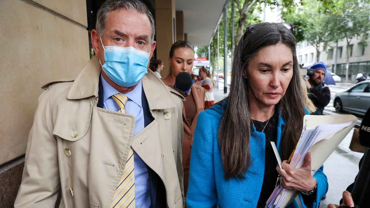 Dr Peter Larkins leaves the Melbourne Magistrates Court with his lawyer. Picture: NCA NewsWire / Ian Currie