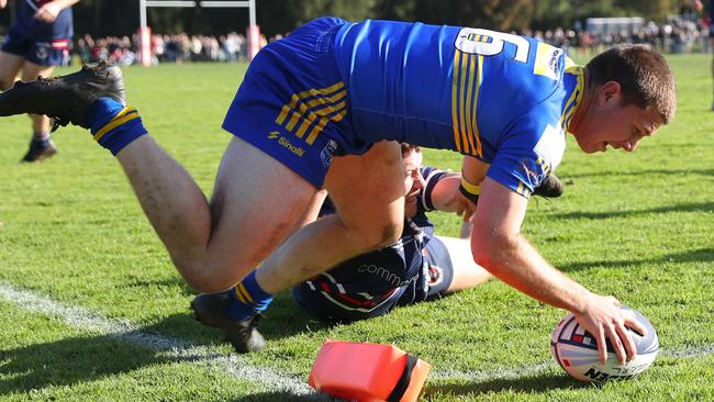 Winger Kiran Page, pictured here scoring in the corner during the team's grand final victory over Erina, is one of the club’s most promising young players. Photo: Paul Barkley