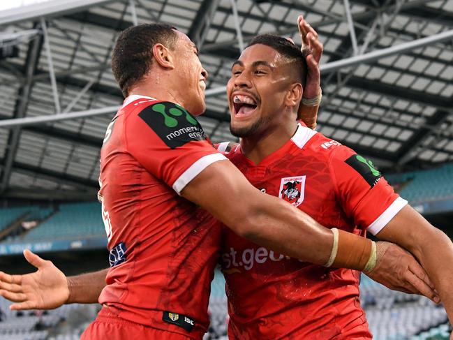 Nene MacDonald (right) of the Dragons is congratulated by Tyson Frizell after scoring a try during the round 5 NRL match between the West Tigers and the St George Illawarra Dragons at ANZ Stadium in Sydney on Sunday, April 2, 2017. (AAP Image/Paul Miller) NO ARCHIVING, EDITORIAL USE ONLY