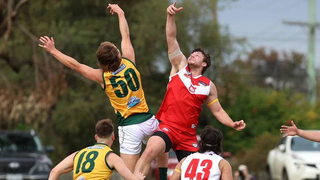 Brock Greaves of Kinglake and Lalor’s Thomas Burn battle in the ruck. Picture: Hamish Blair