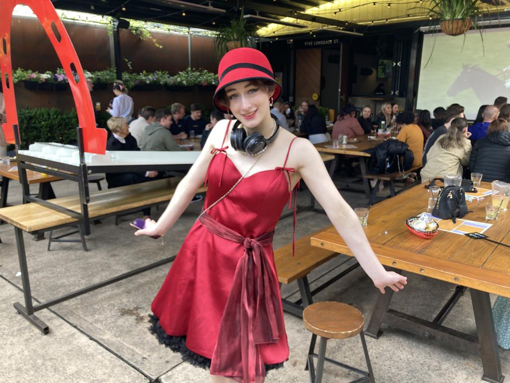 Melbourne Cup Canberra. Florian Nahrung from Braddon at Hopscotch Bar dressed to the nines, hat and headphones included. She said her entire outfit was thrifted. Picture: Julia Kanapathippillai