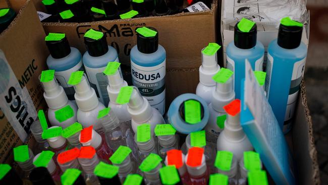 A box of hand sanitiser and other disinfectant liquids, used by many during the new coronavirus COVID-19 pandemic, are on sale outside a shop in Berlin's Kreuzberg district on March 18, 2020. (Photo by David GANNON / AFP)