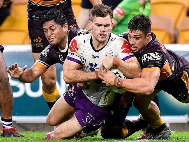 BRISBANE, AUSTRALIA - JULY 24: Ryan Papenhuyzen of the Storm scores a try during the round 11 NRL match between the Brisbane Broncos and the Melbourne Storm at Suncorp Stadium on July 24, 2020 in Brisbane, Australia. (Photo by Bradley Kanaris/Getty Images)