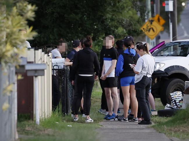 Teens gathering at the scene hours after the stabbing. Picture: Richard Dobson