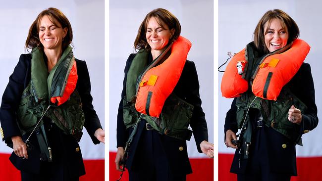 Catherine, Princess of Wales appears somewhat flustered as she inflates an emergency life jacket whilst conducting a training exercise with Royal Navy Survival Equipment Technicians during a visit to Royal Naval Air Station (RNAS) Yeovilton in Yeovil, England. The Princess of Wales is visiting the airbase following her recent appointment by King Charles III as Commodore-in-Chief, Fleet Air Arm (FAA). Picture: Max Mumby/Indigo/Getty Images