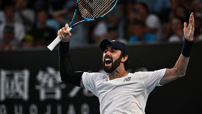 Jordan Thompson celebrates after victory against Australia's Aleksandar Vukic. (Photo by Lillian SUWANRUMPHA / AFP)