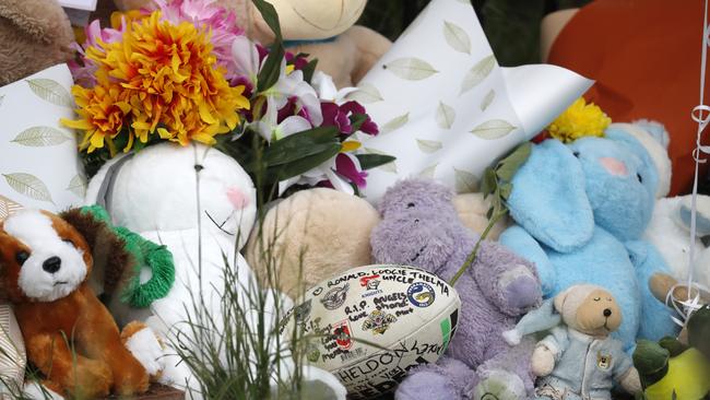 Tributes, flowers and teddy bears at the crash scene. Picture: Jonathan Ng