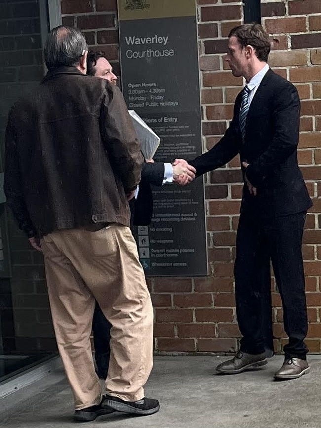 McCarthy (right) outside court with his lawyer and a supporter.