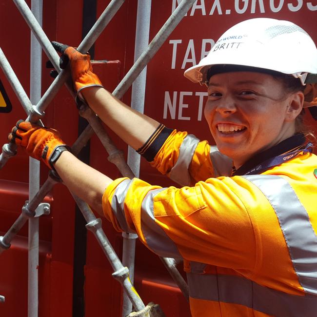 Britt Gibson’s job as a stevedore sees her climbing on and off ships and driving straddle carrier that can lift 60-ton shipping containers. Picture: SUPPLIED