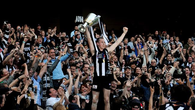 Nick Maxwell holds the 2010 premiership cup aloft.