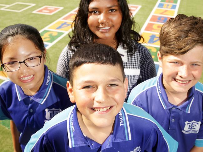 Almost 80 per cent of Thomastown East Primary School students are from non-English speaking backgrounds. The school developed it's own literacy and numeracy strategy to teach such diverse students and, as a result, has greatly improved NAPLAN results over the years. Jason (Front) Vicky (L) Sandhya (Back) and Enes (R)  Picture Norm Oorloff