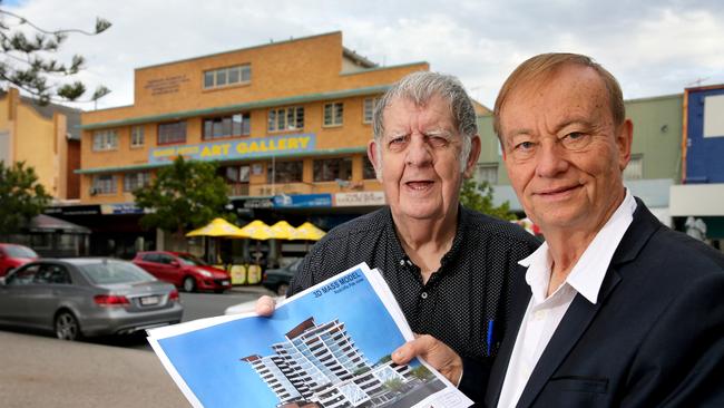 Comino’s Arcade will be transformed into a 13-storey building with 89 units and retail spaces. Dennis Austen for the developer and architect Alex Enborisoff with an illustration and the historic building in the background. Picture: Chris Higgins.