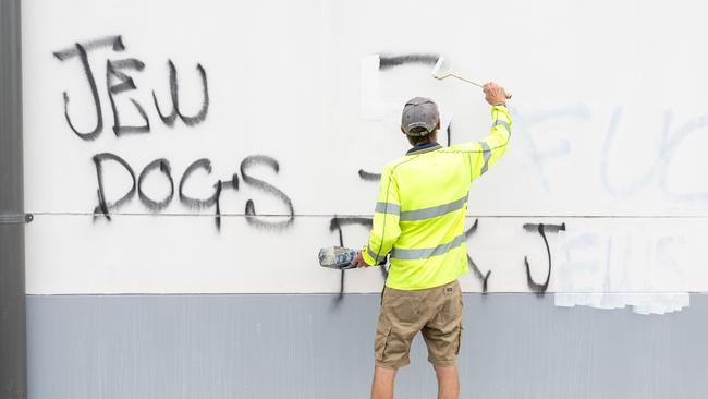 Graffiti removalists painted over anti-Semitic graffiti on Mount Sinai College in Maroubra. Picture Thomas Lisson