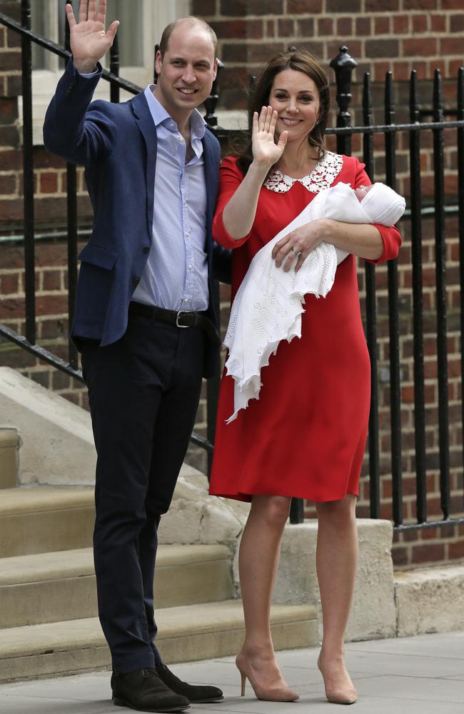 Prince William and Kate, Duchess of Cambridge wave as they hold their newborn son at St Mary's Hospital in London. Picture: AP Photo/Tim Ireland