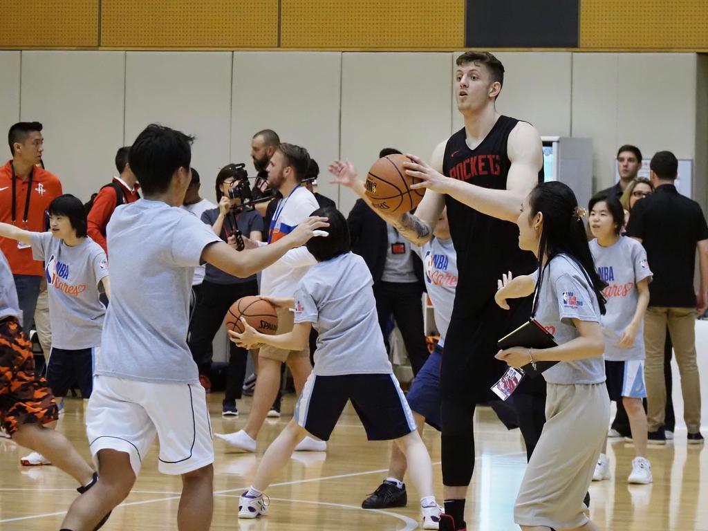 Houston Rockets power forward Isaiah Hartenstein provides instructions during an NBA Cares basketball clinic by the team in Tokyo, The Rockets are in Tokyo to play two exhibition matches this week. Picture: AFP