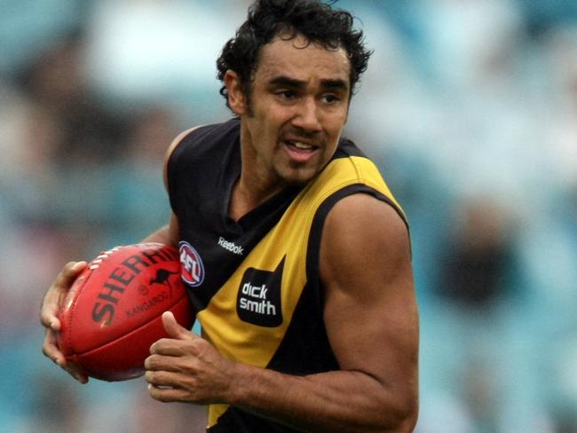 AFL football - Port Adelaide Power v Richmond Tigers match at AAMI Stadium. Richard Tambling of Richmond gets away from Nathan Krakouer.