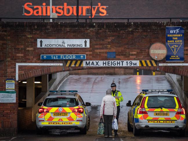 SALISBURY, ENGLAND - MARCH 12:  Police cordon off the upper level of a Sainsbury's supermarket car park, opposite the park bench where Sergei Skripal was found, as investigations continue into the poisoning of Sergei Skripal on March 12, 2018 in Salisbury, England. Sergei Skripal who was granted refuge in the UK following a 'spy swap' between the US and Russia in 2010 and his daughter remain critically ill after being attacked with a nerve agent.  (Photo by Chris J Ratcliffe/Getty Images)