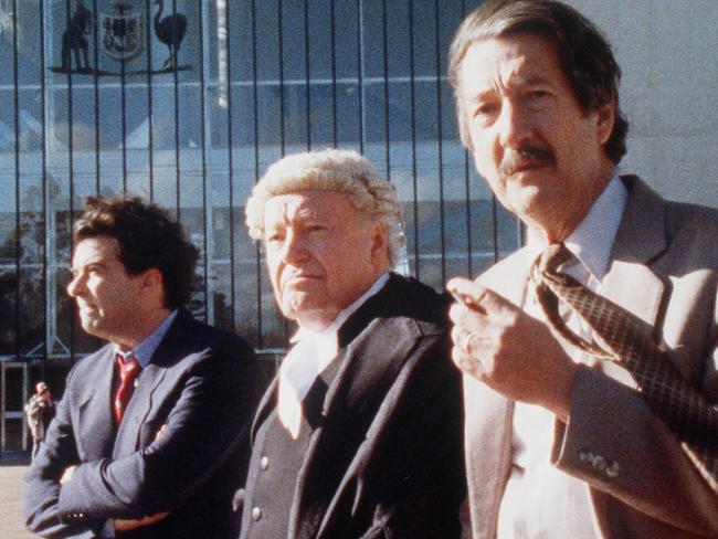 The Castle characters Dennis Denuto, Lawrence Hammill and Darryl Kerrigan outside the High Court of Australia.